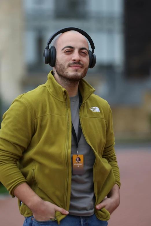a man is wearing ear muffs and headphones