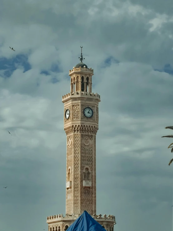 there is a large tall tower that has a clock on it