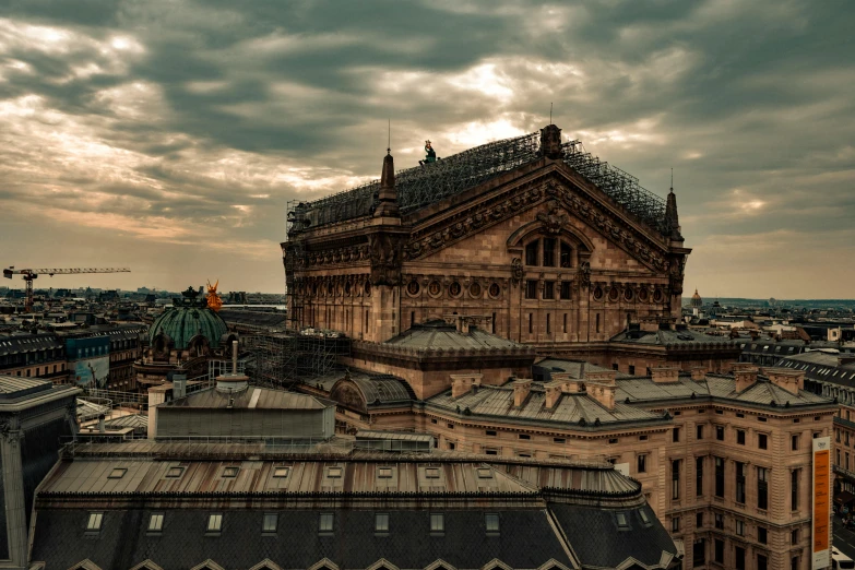 a very large clock tower over a large city