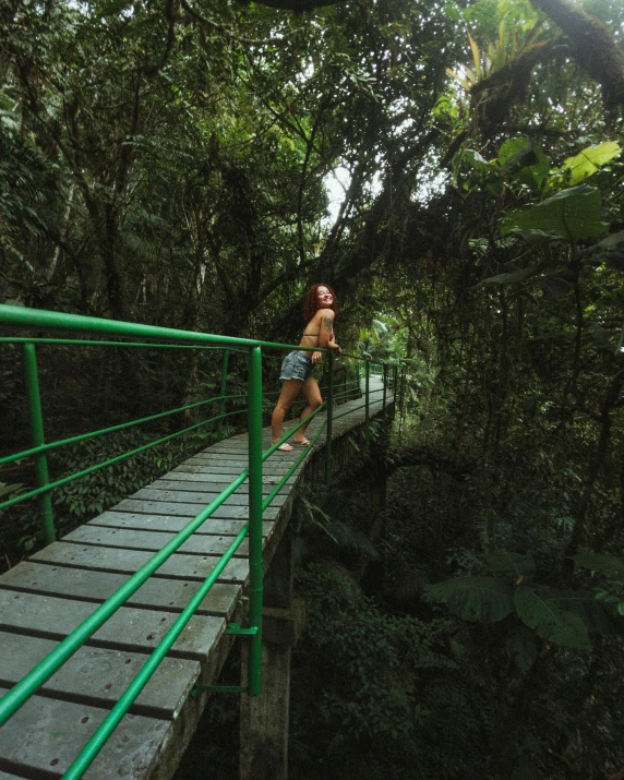 a person is on a bridge above some water