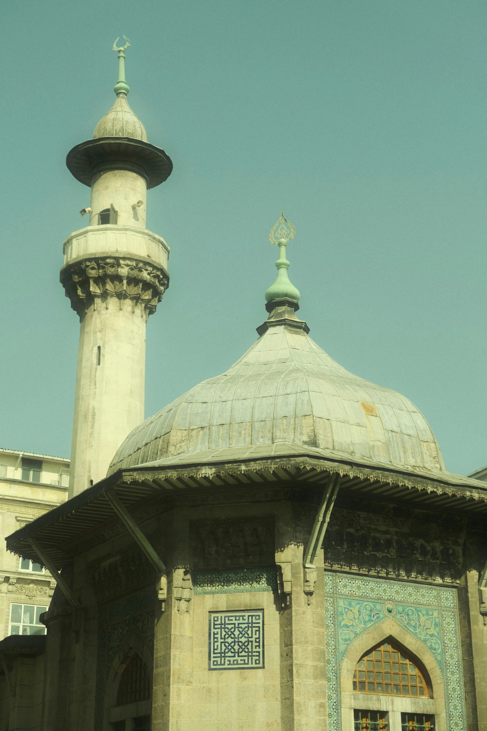 an old structure with a statue on top of it