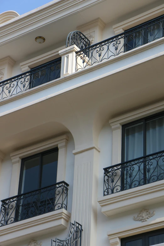 this is a building with a balcony and wrought iron balconies