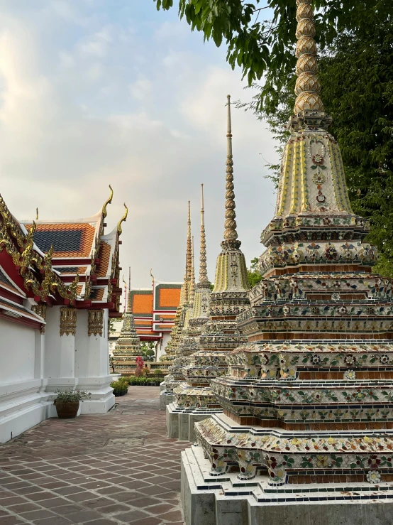 the temples are lined up along the brick wall