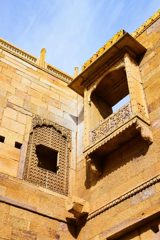 some building with two windows and some pillars on each side