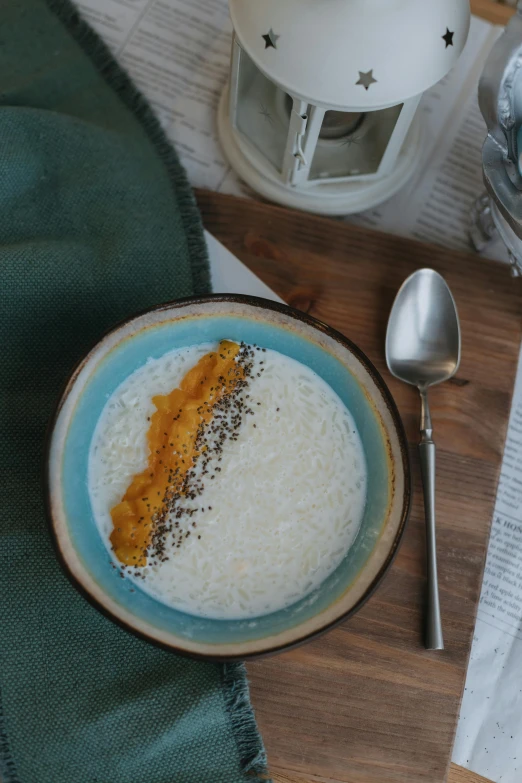 this is a close up view of a plate with rice and a side of beans