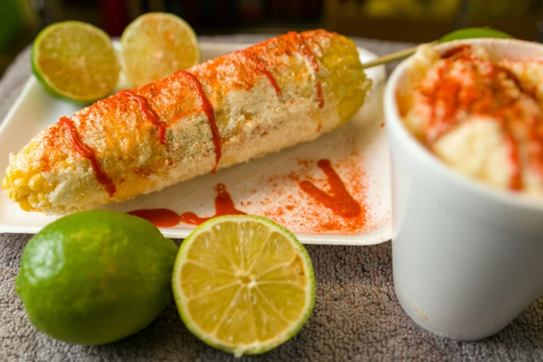 a plate filled with food and two cups