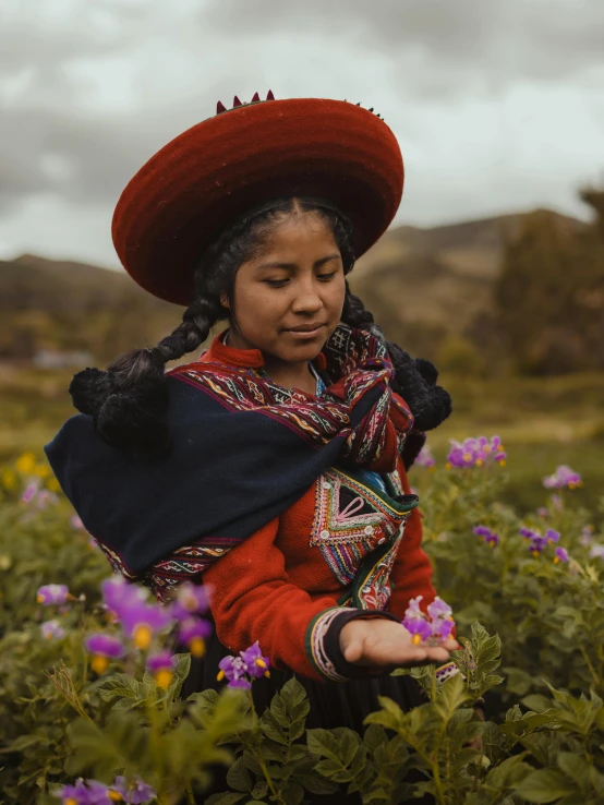 the woman in red is wearing a big hat