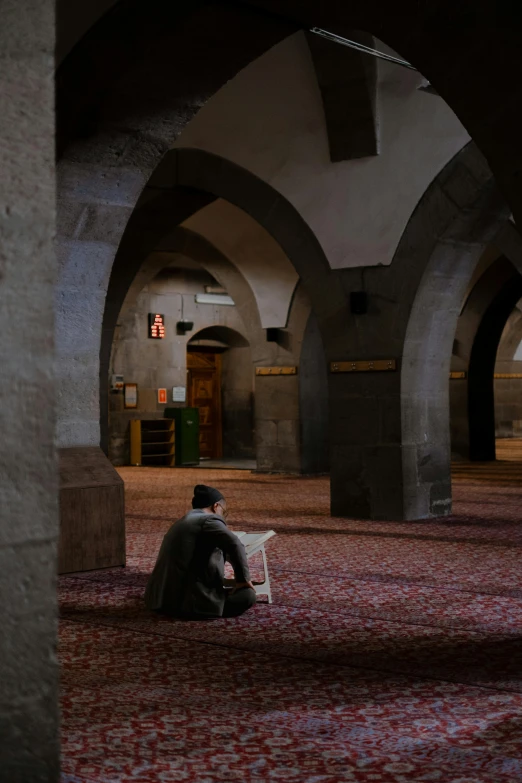 a man in the middle of an old carpet store