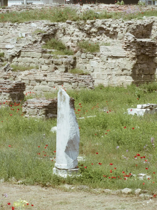 there is a very large stone monument in the field