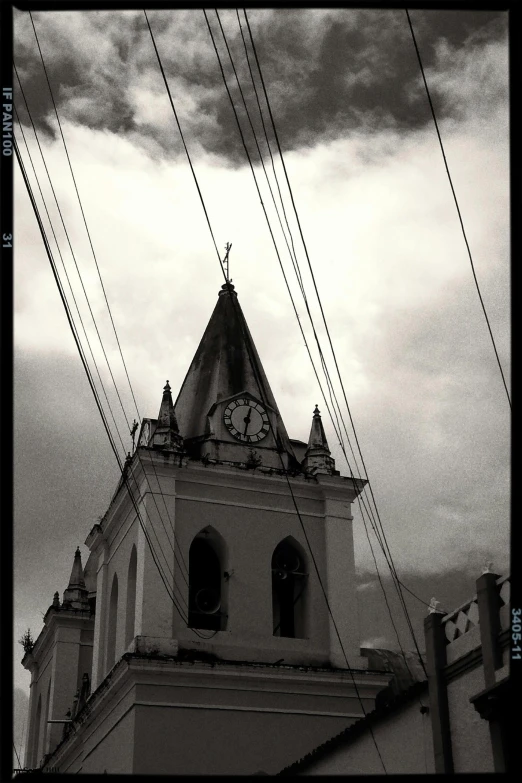 the tower of an old church with a clock in it