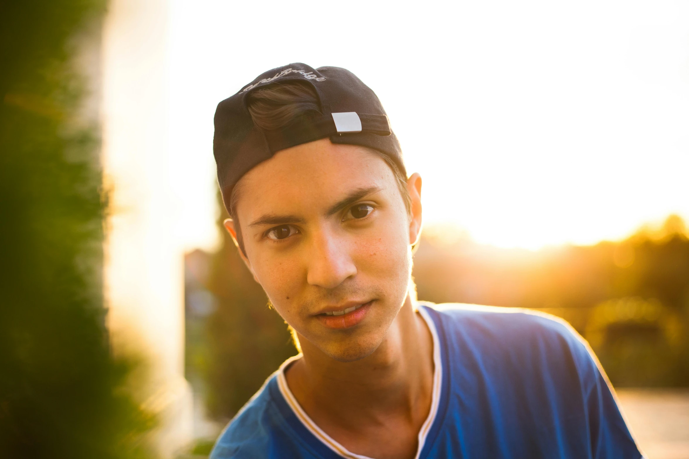 a man with a hat and blue shirt