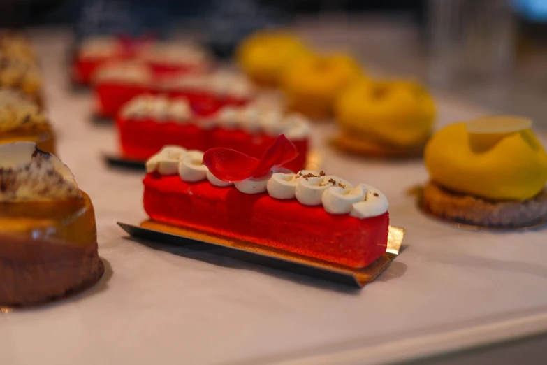 desserts are being displayed on a table at a party