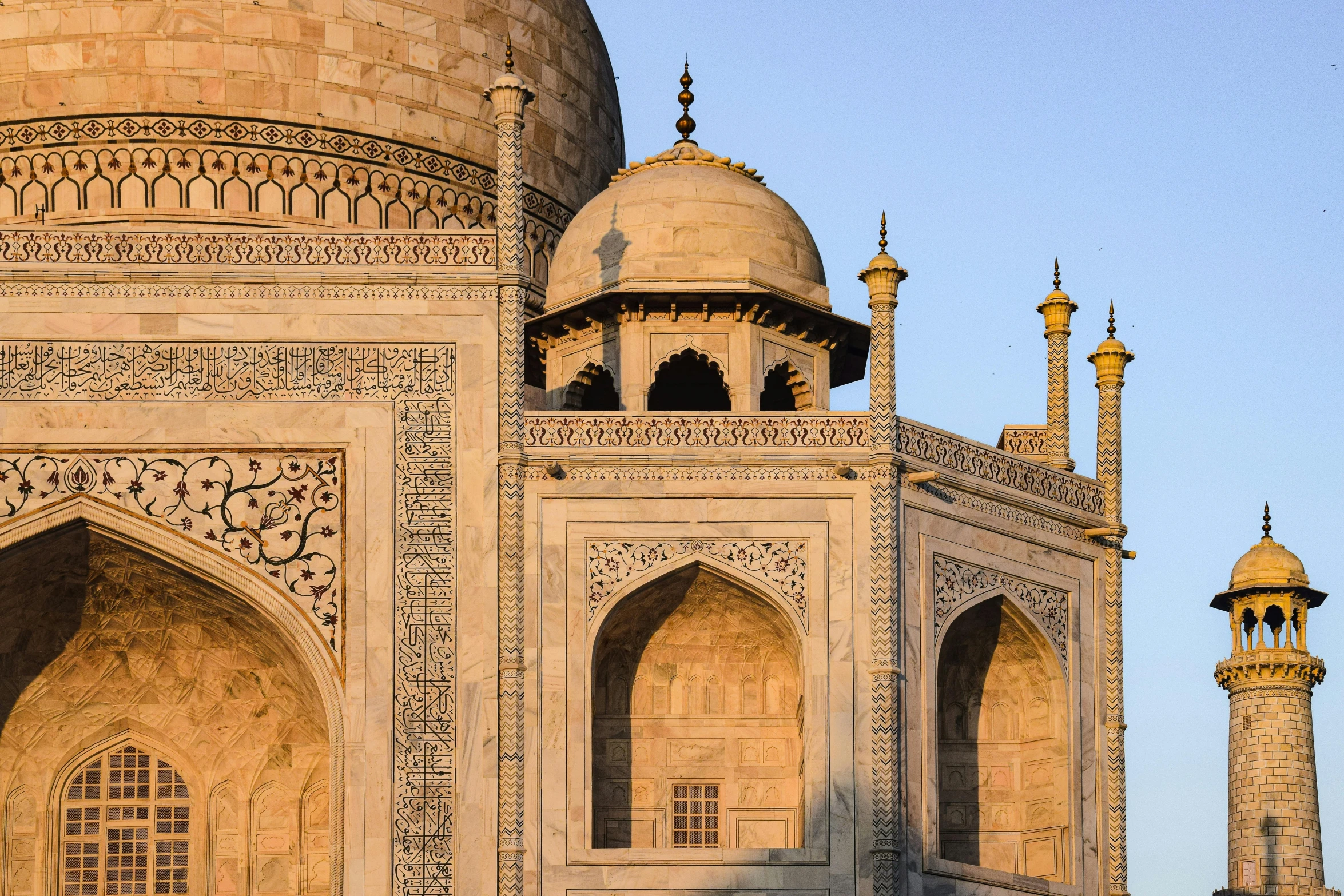 several spires on top of a building with two towers