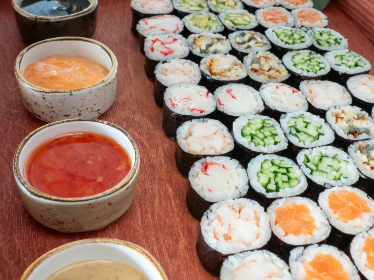 sushi ingredients layed out on a wooden board