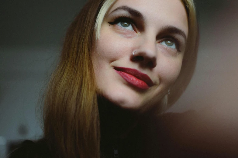 a close up of a person with a red lip