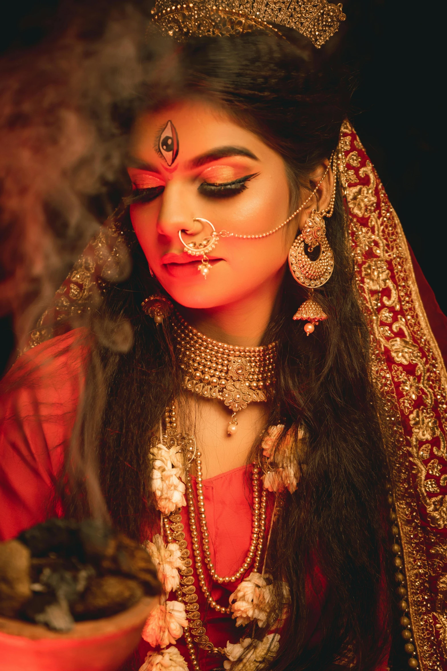 a woman in a indian costume, is smoking