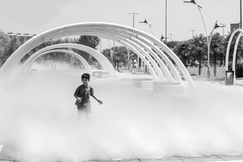 there is a man riding his skateboard through a cloud of mist