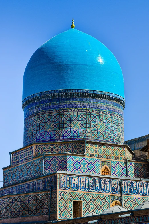 an intricately designed building on top of a hill