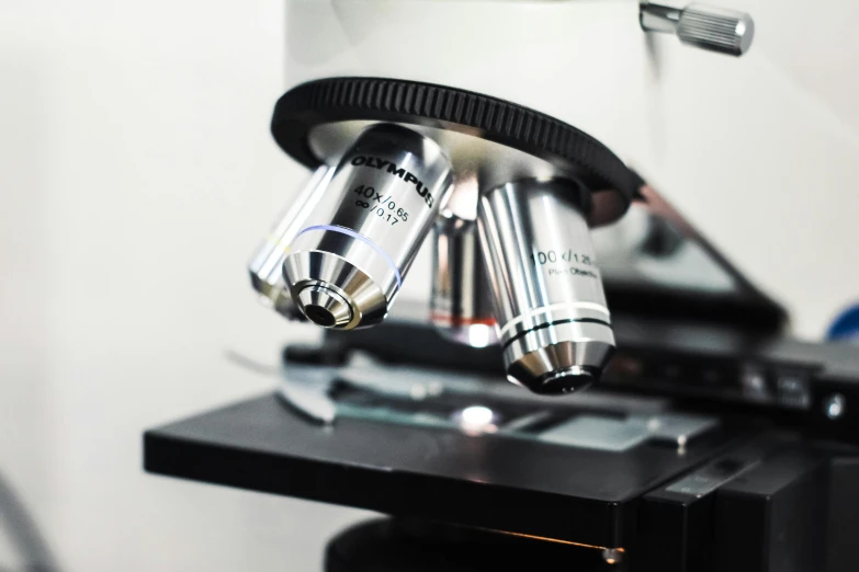 two microscopes are open on top of a table