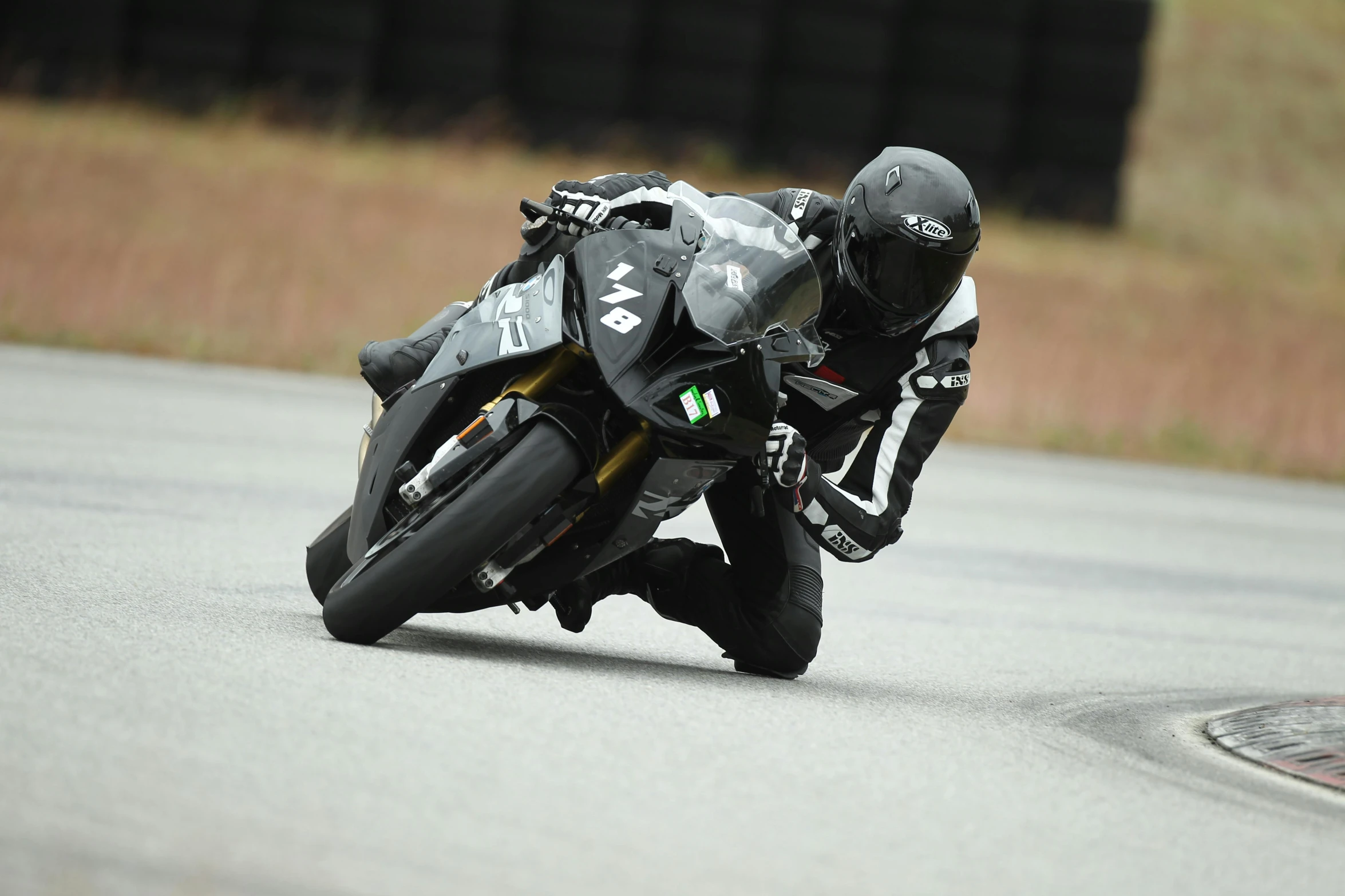 a person on a motorcycle leaning into the turn