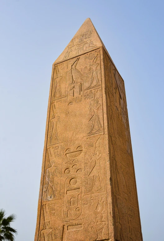 an egyptian monument, with people carved into it