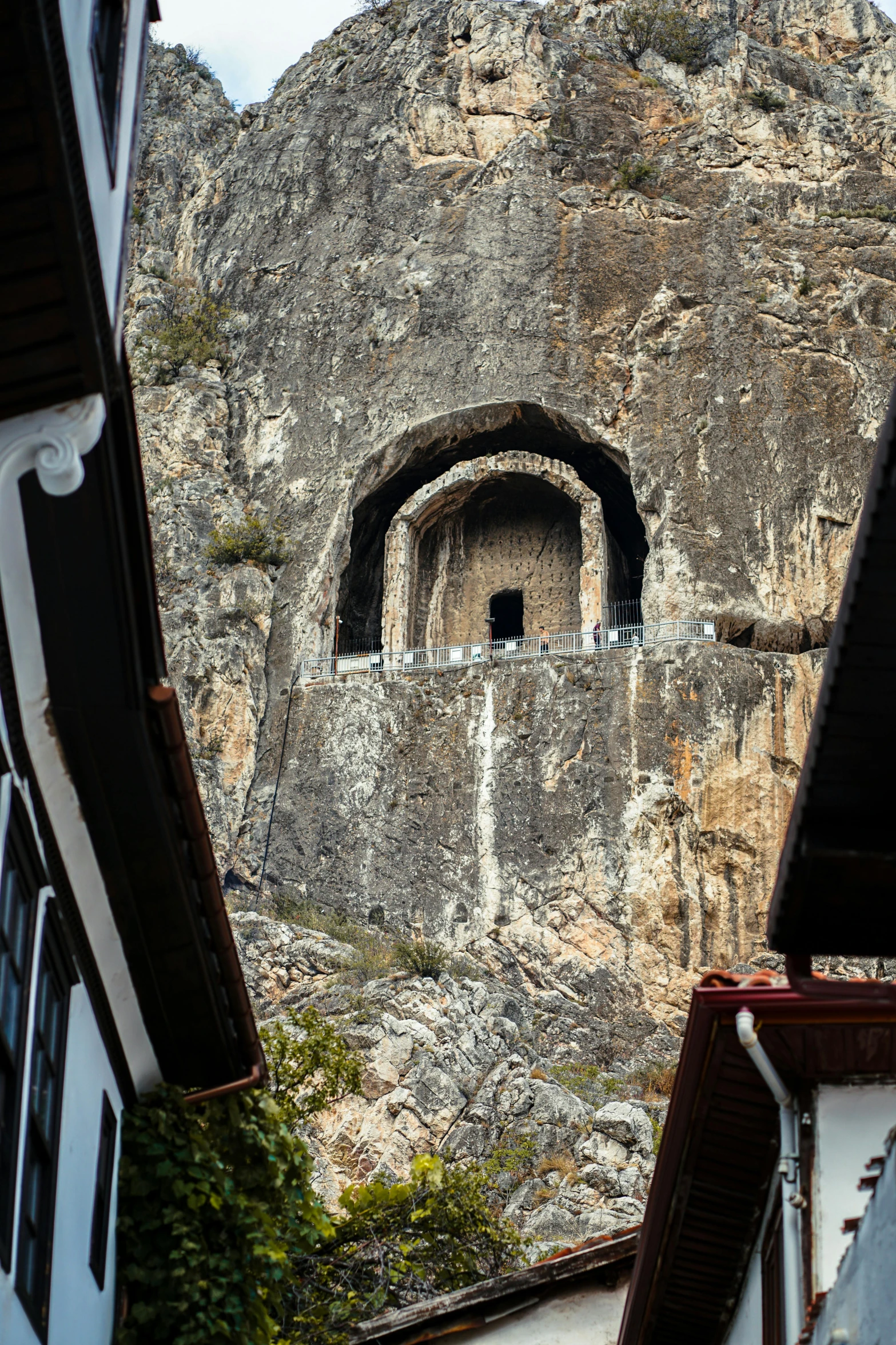 an old style structure in the middle of a mountainside