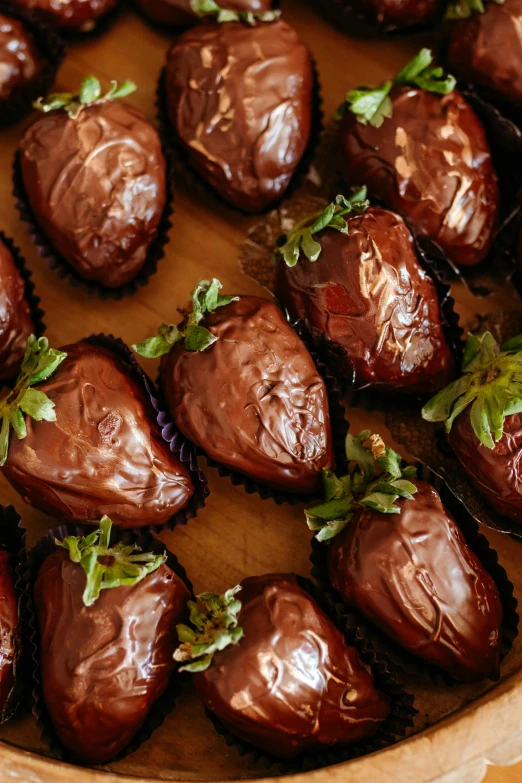 a tray filled with chocolate covered strawberries