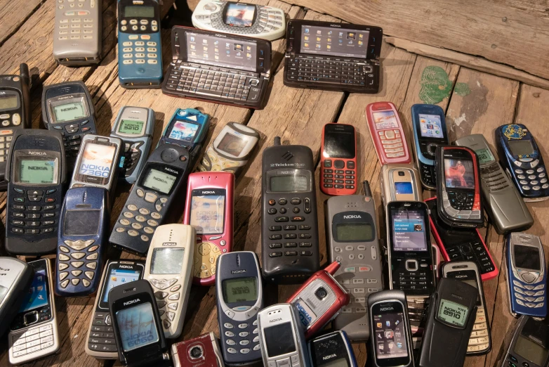 a pile of cell phones on the ground