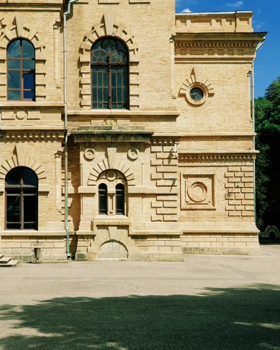 a yellow building with many windows on it