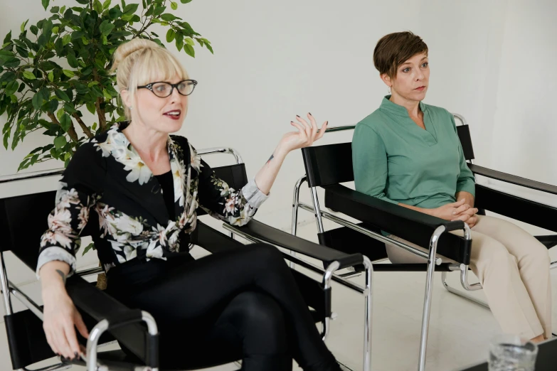 two women who are sitting next to each other