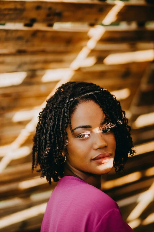 a woman with glasses standing by the side