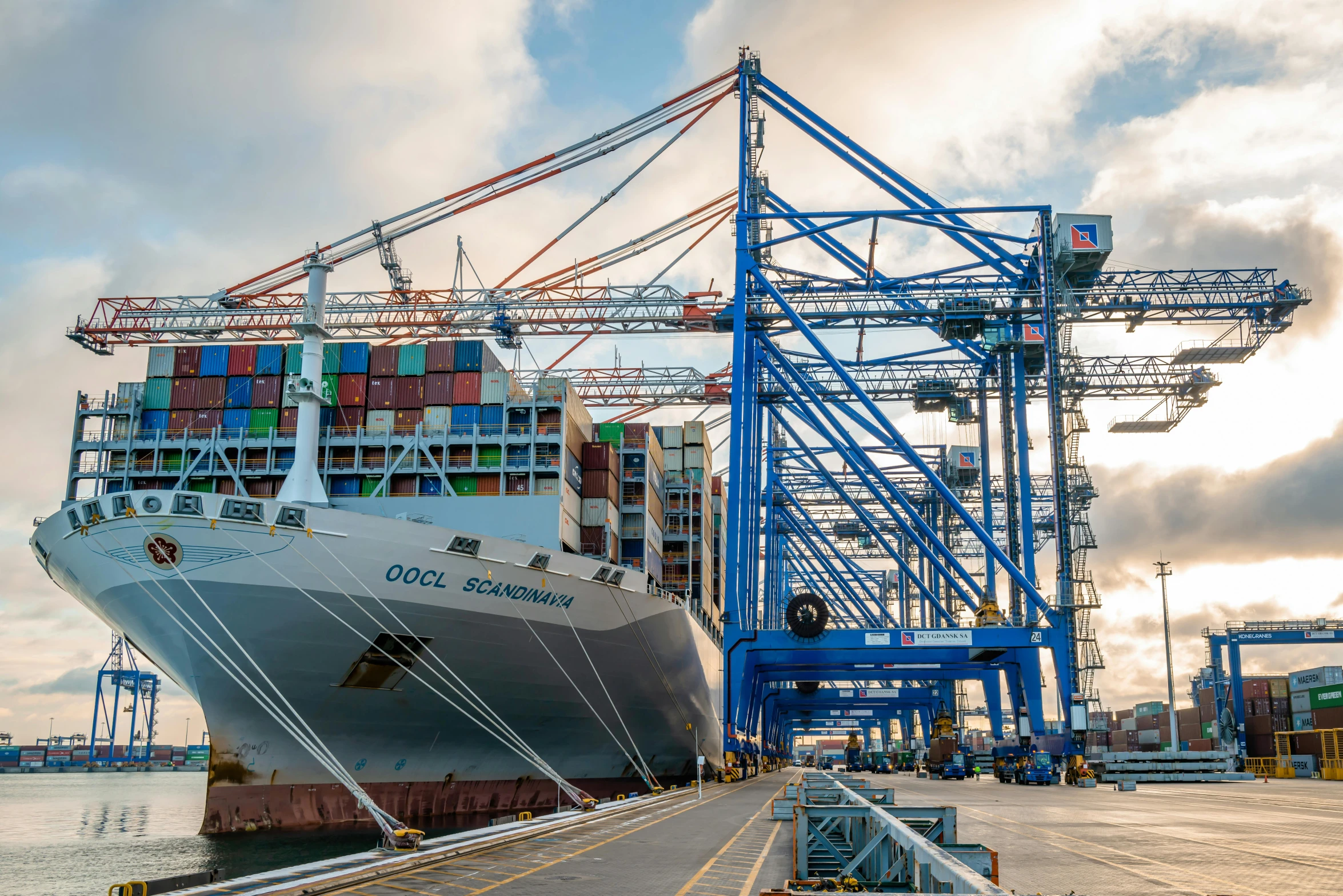 an empty shipping container sits docked at a dock