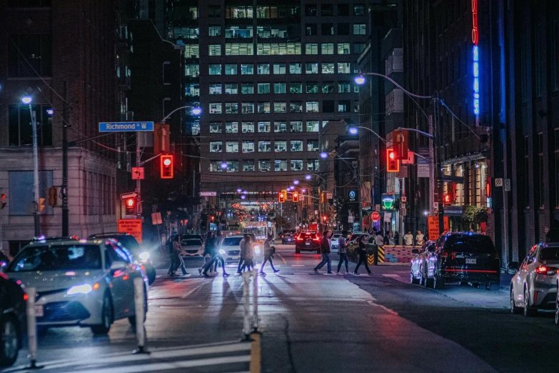 a city street with a lot of traffic and tall buildings