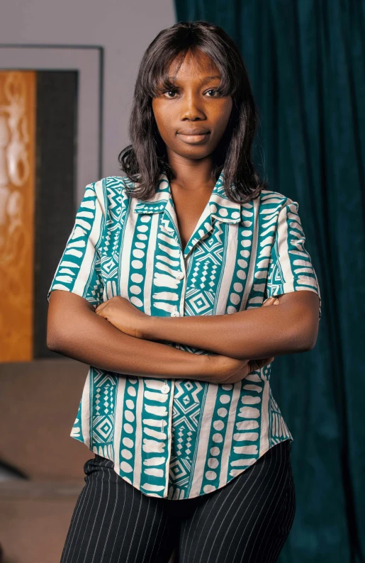 a women who is standing with her arms crossed