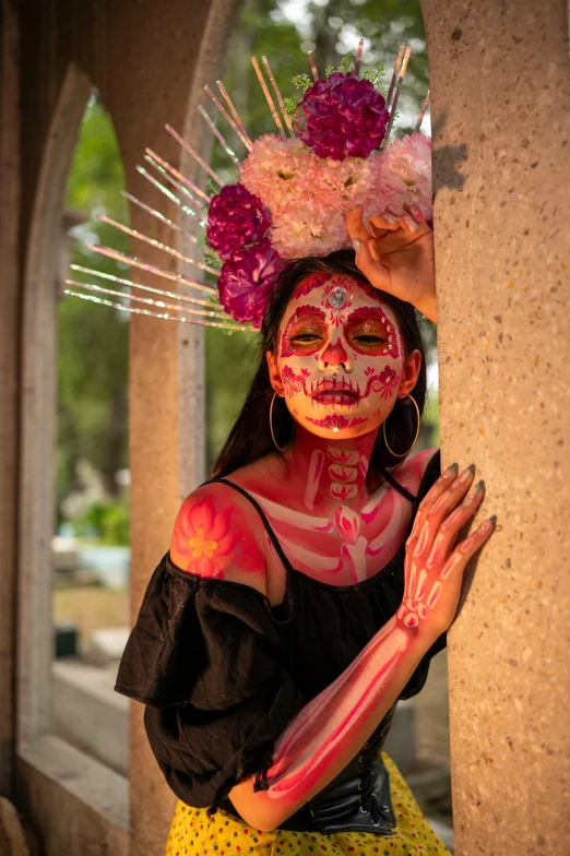 a woman with colorful makeup and flowers in her hair