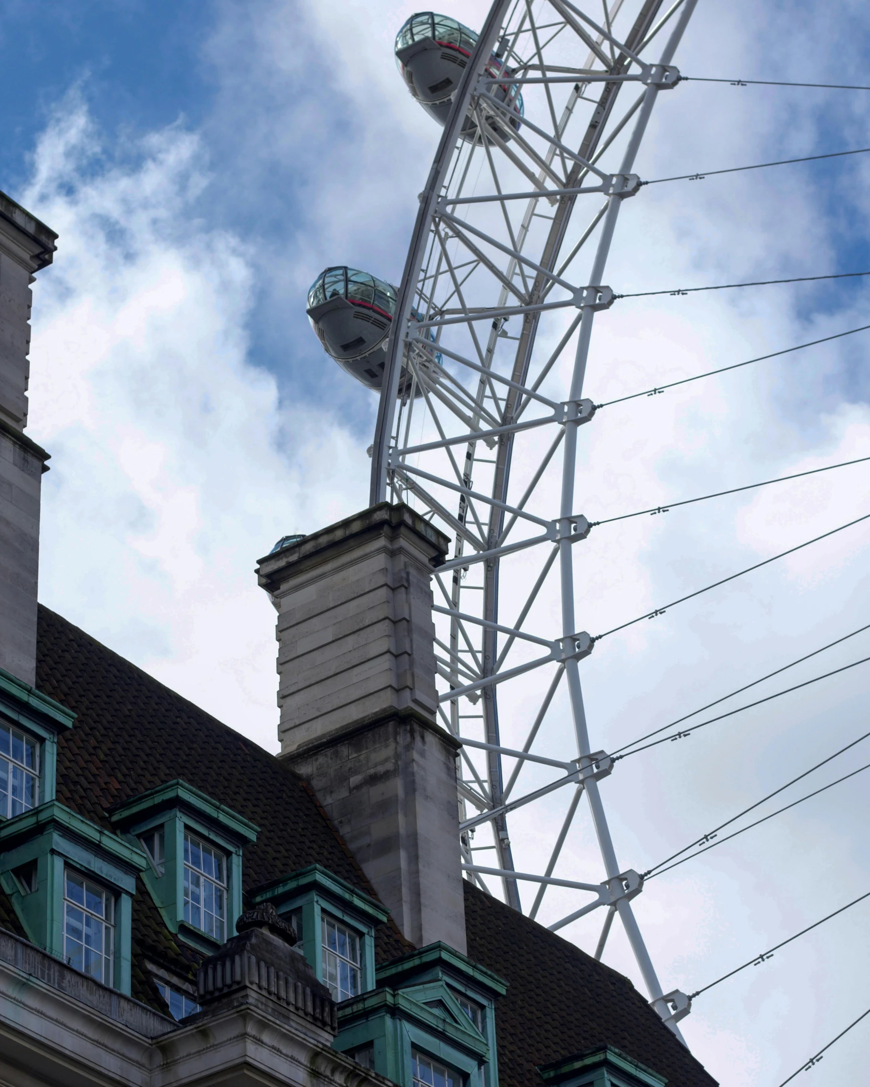 an image of a ferris wheel on the roof of an old building