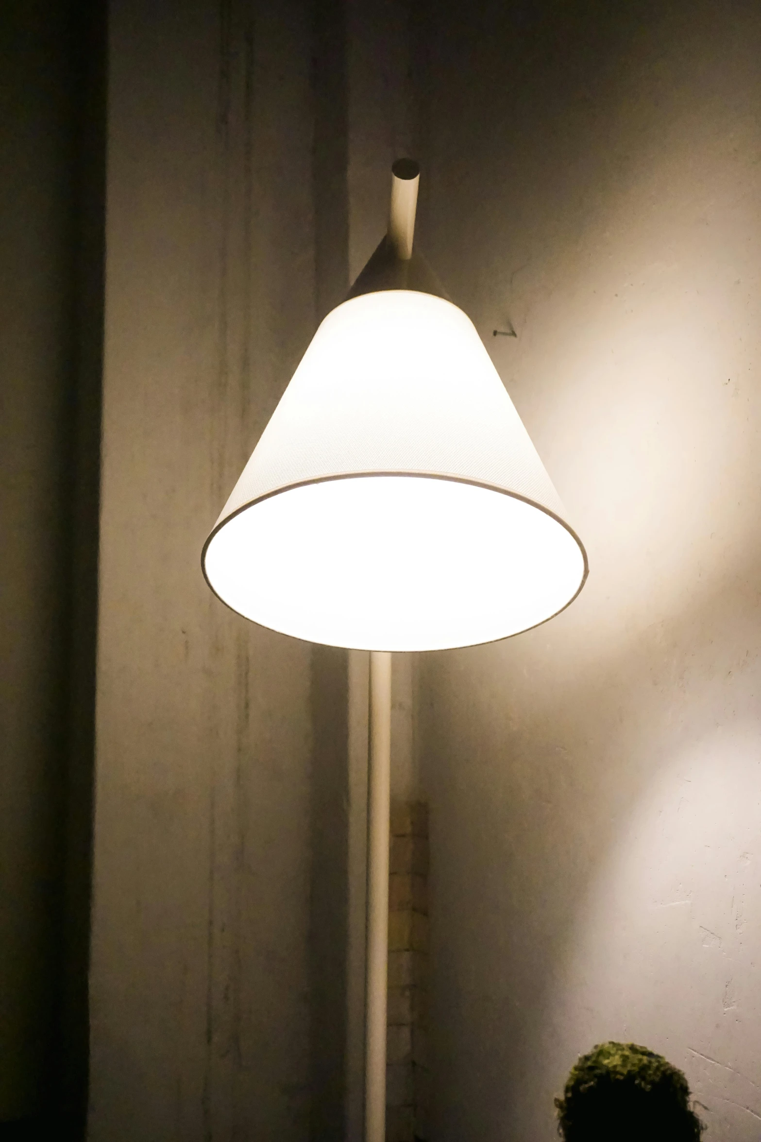 a lamp that is on in the corner