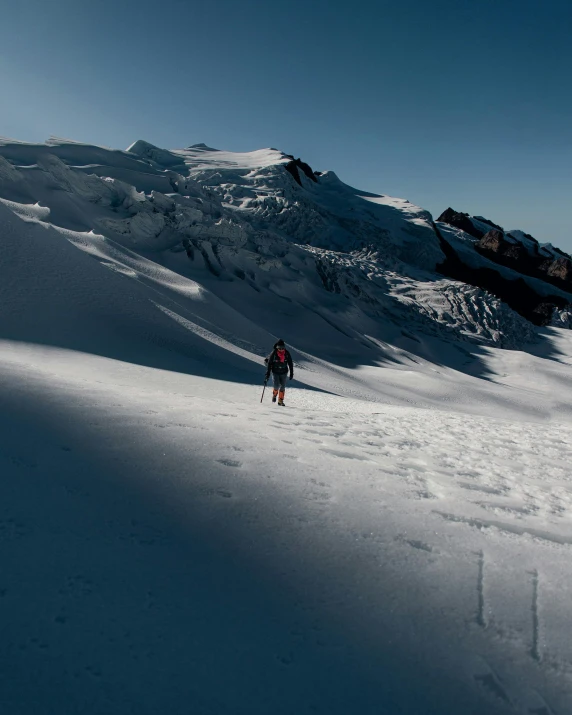 a person in red jacket skiing down slope