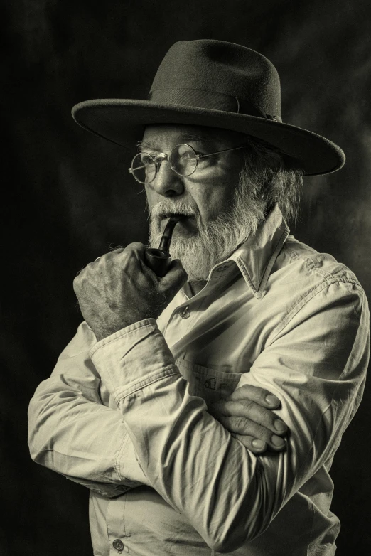a black and white po of an old man with a cigar in his mouth
