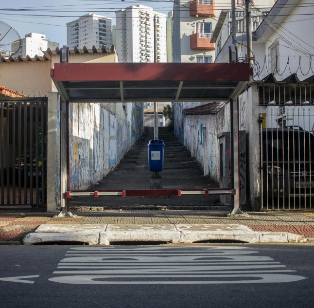 a street with buildings and a parking meter in the middle