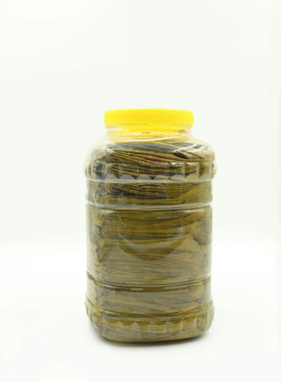 close up of jars of pickles on a white background