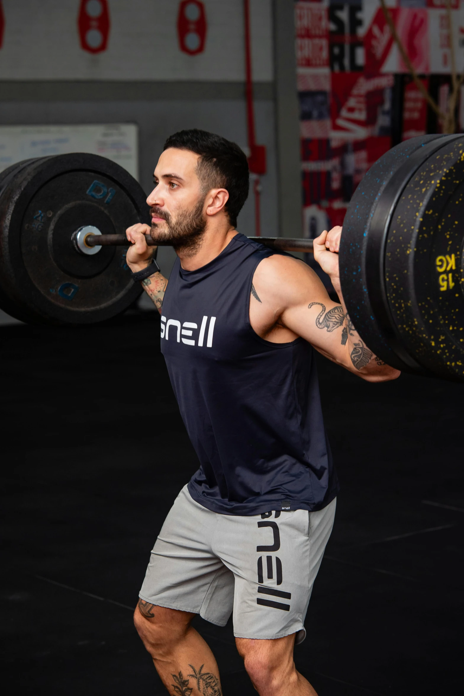 a man in the gym is performing deadlift