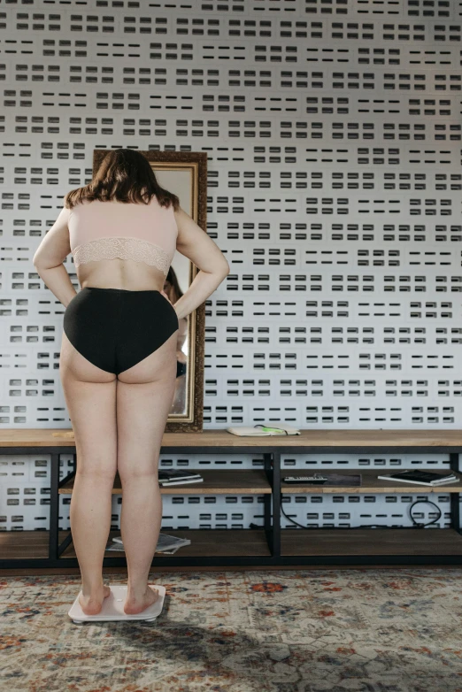 the back of a woman in her underwear