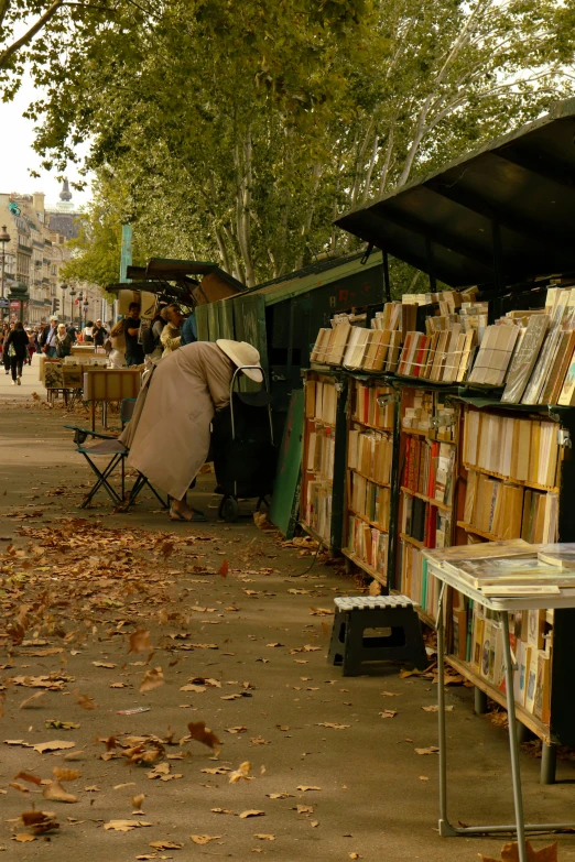 books are in the sun on the sidewalk