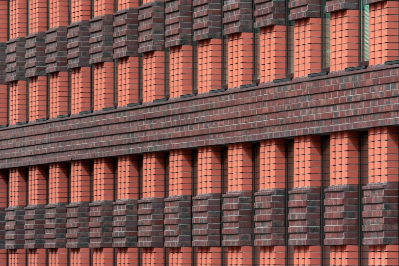 a building has bricks and a clock on top