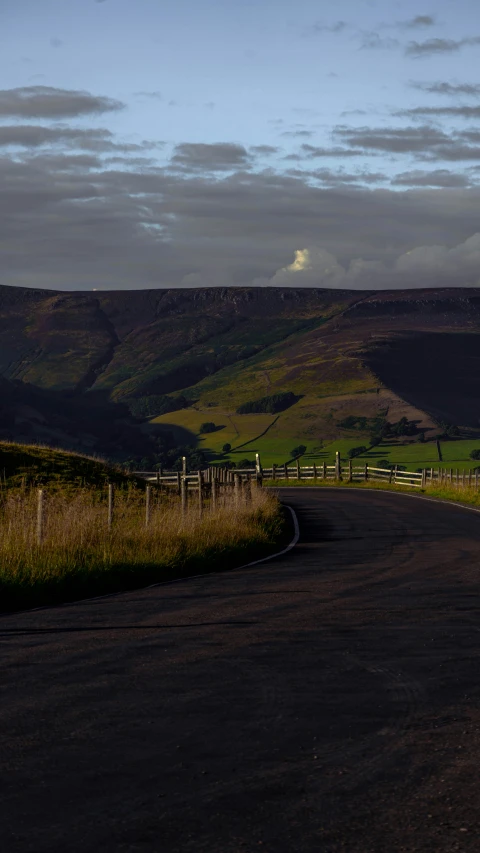 there is a road in the middle of a hill