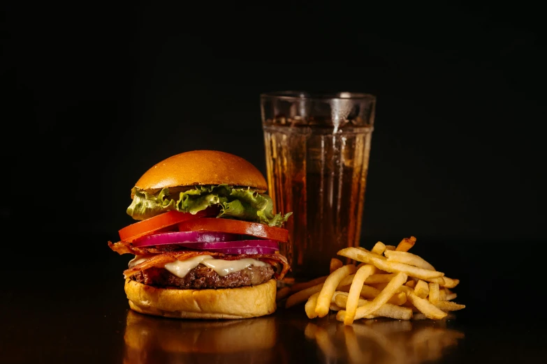 a hamburger and french fries on the table