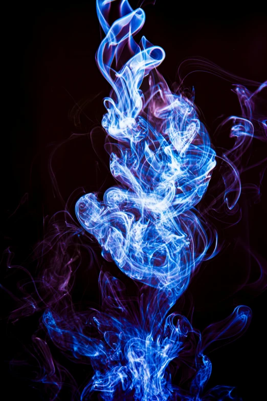 smoke and water in blue and red colors on black