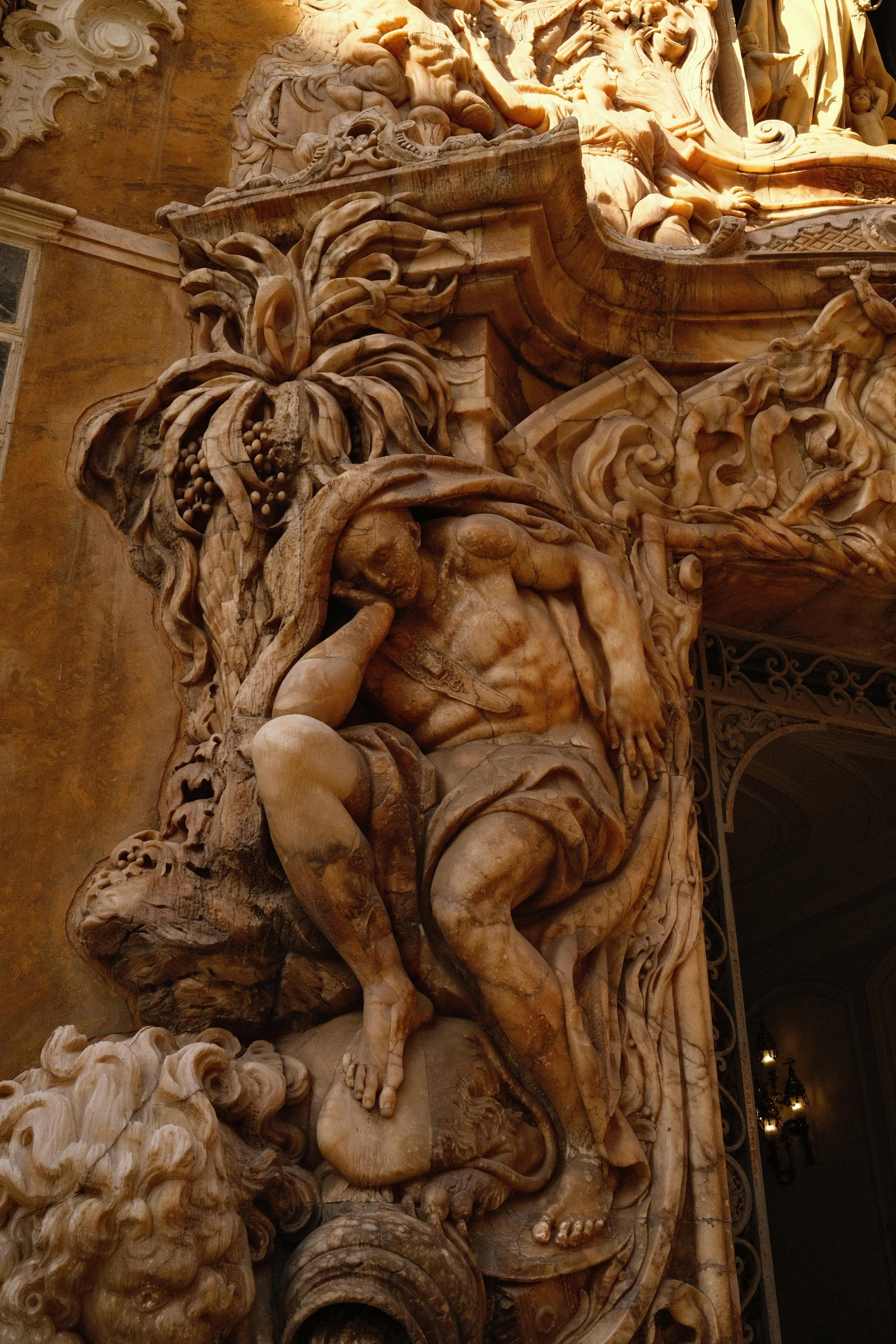 an intricate carving in stone that is on the side of a building