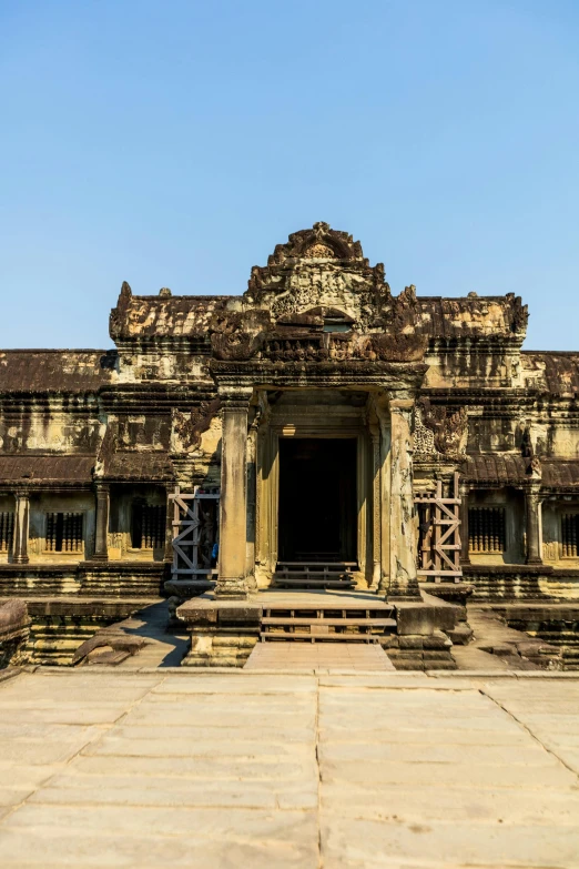 a large old temple sitting on the edge of a park